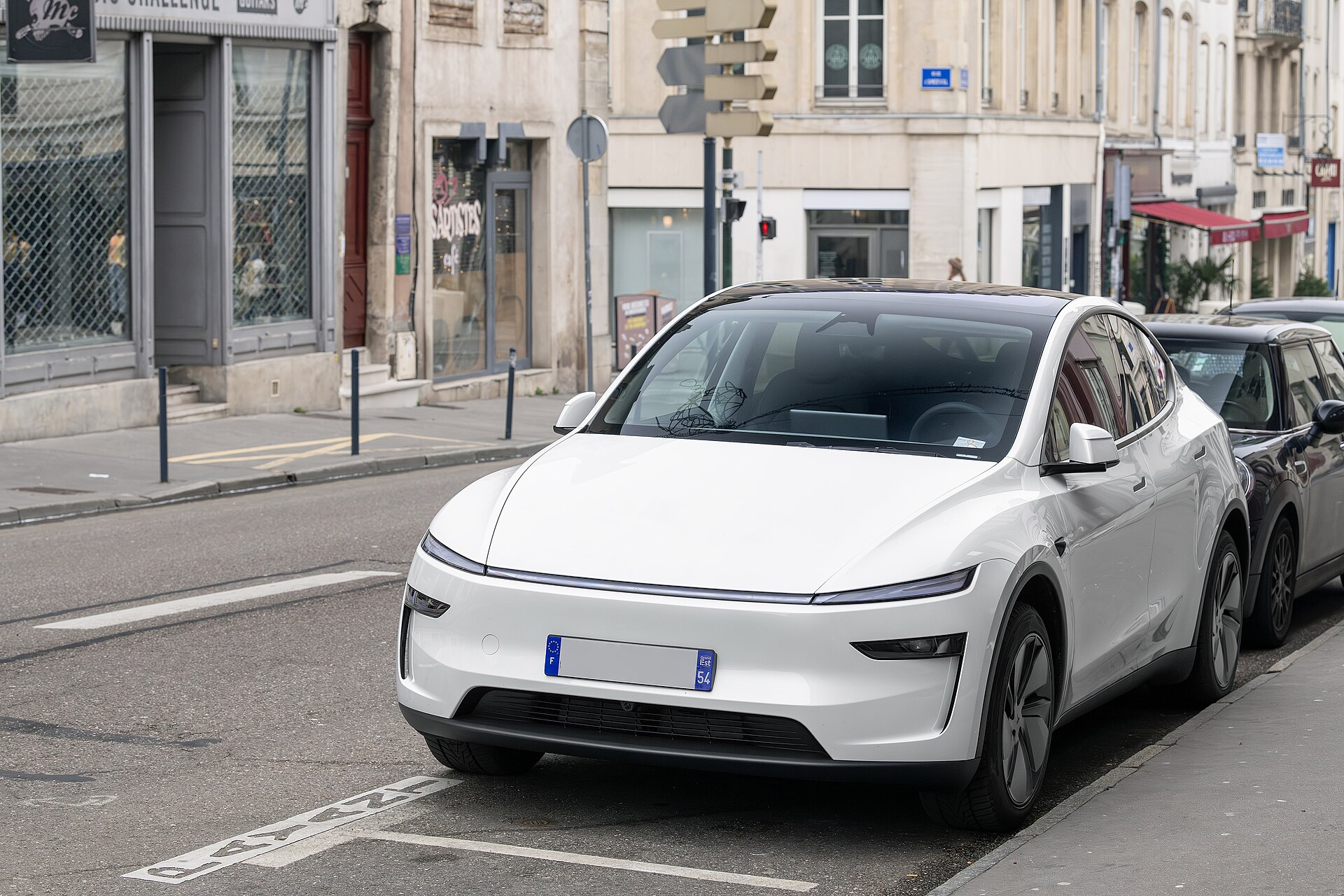 2026 Tesla Model Y (Juniper) parked outdoors, front three-quarter view